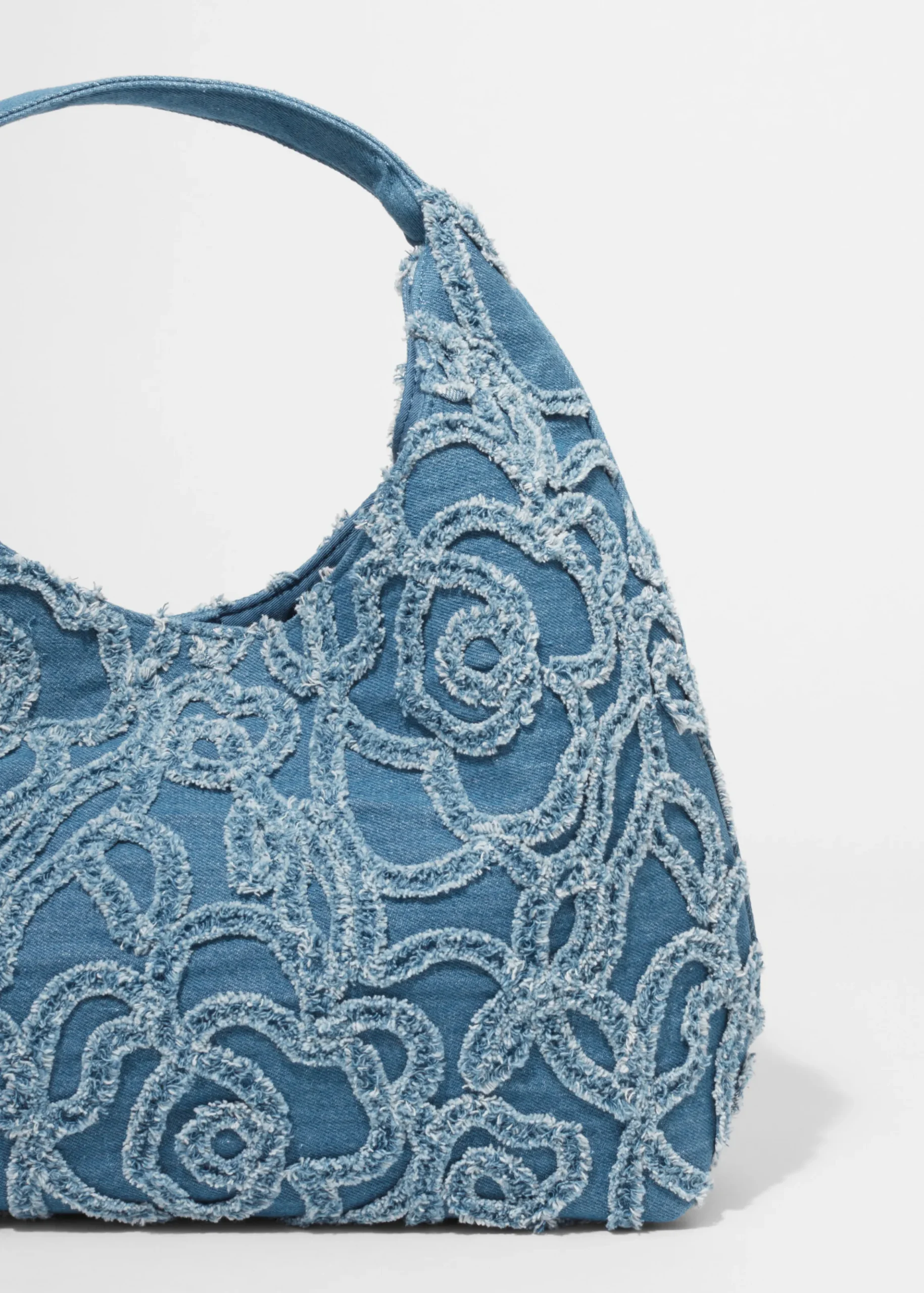 Kleine Tragetasche aus Denim mit Applikationen