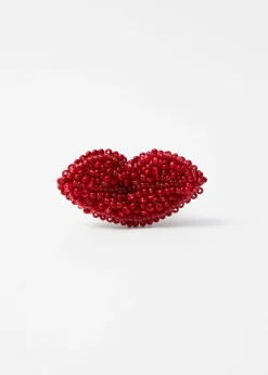 Perlenring mit Verzierung in Lippenform