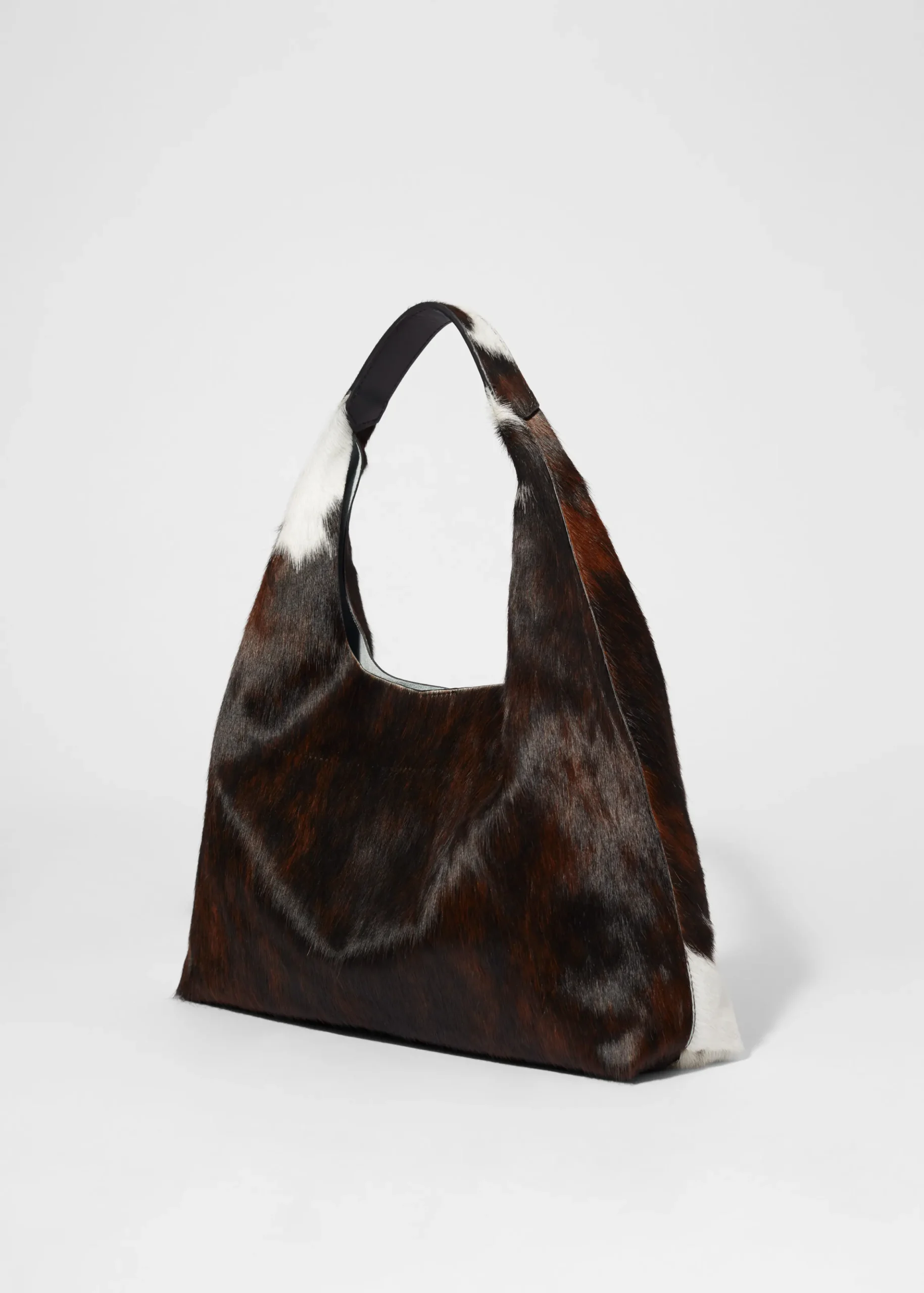 Tragetasche aus Leder mit Kuh-Print