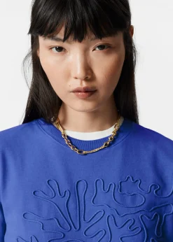 T-Shirt mit Blumenapplikation