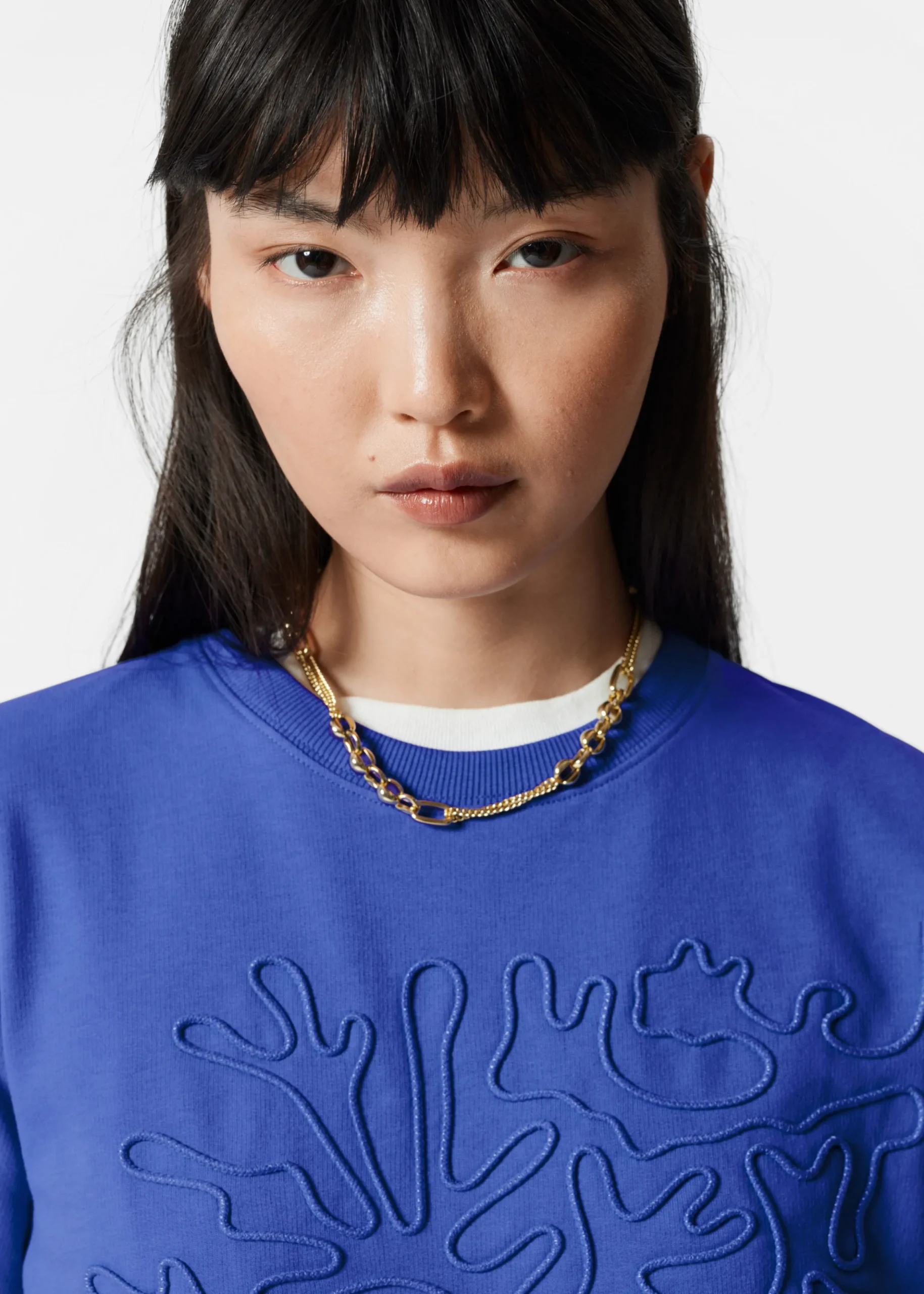 T-Shirt mit Blumenapplikation