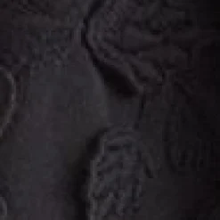 Voluminöse Bluse mit Blumenapplikation